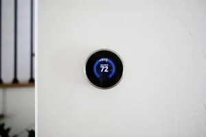 Digital thermostat on wall